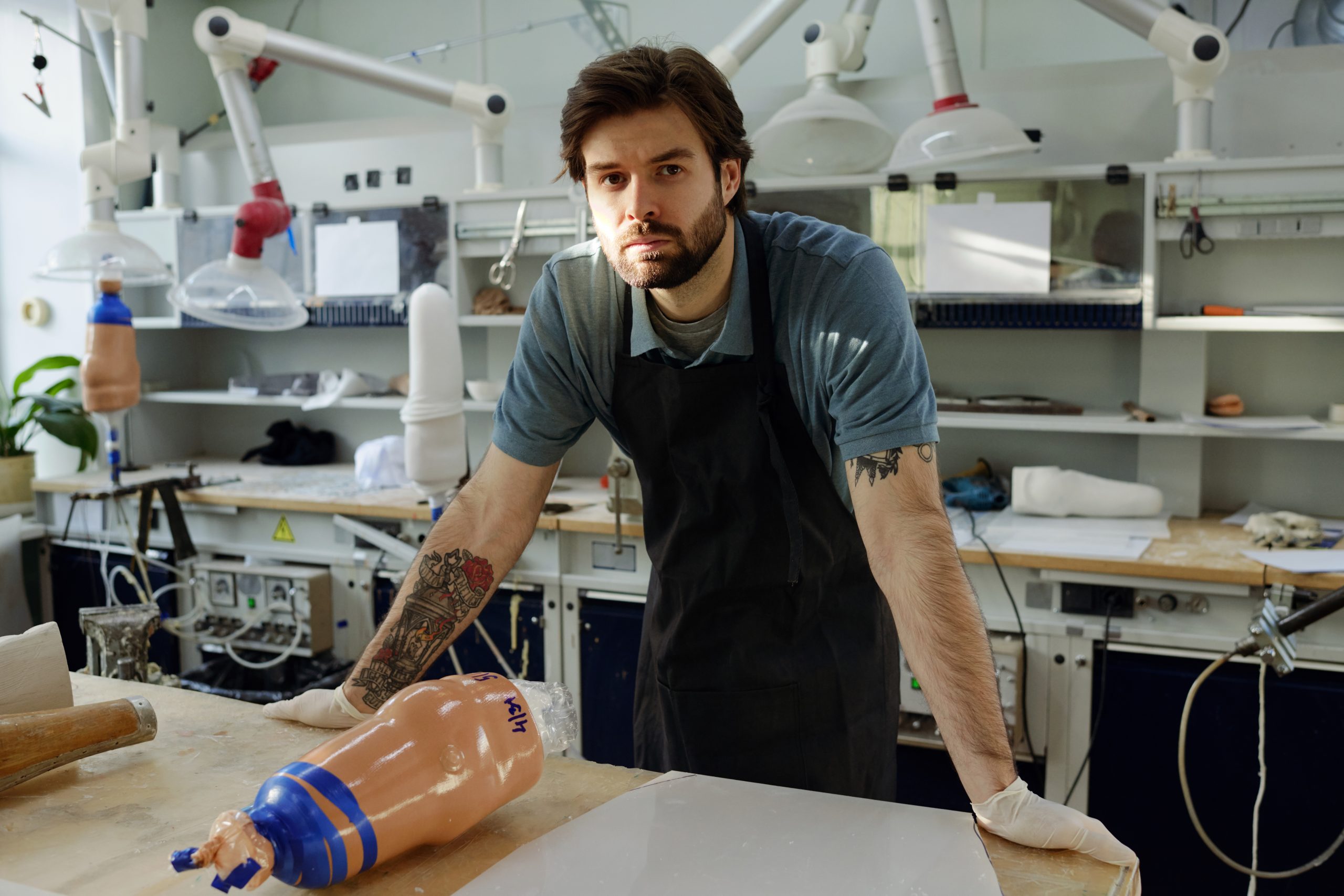 Young confident worker of manufactory standing by workbench Upskill Now - young confident worker of manufactory standing by 2022 03 02 18 49 57 utc scaled