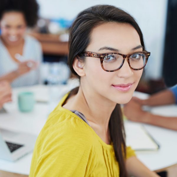 Upskill Now - portrait of a young office worker with colleagues 2022 10 07 20 27 12 utc scaled